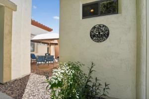 a house with a sign on the side of a building at Elm Casita Apts in Litchfield Park