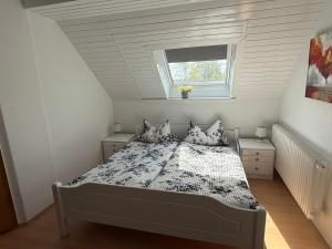 Un pat sau paturi într-o cameră la Küstenkännchen