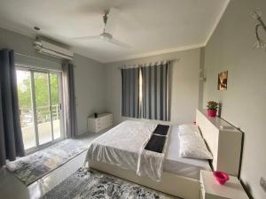 Ένα ή περισσότερα κρεβάτια σε δωμάτιο στο Nile Spirit Apt 2 +22 φωτογραφίες