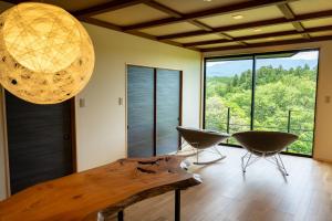 a room with a table and chairs and a large window at Fujinomiya - House - Vacation STAY 20037 in Fujinomiya