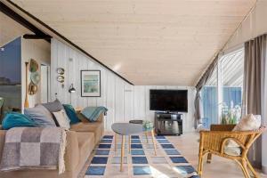 a living room with a couch and a table at L18-Rodby-Vibevej-9 in Rødby