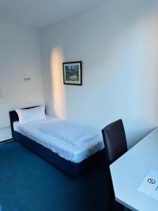 Katil atau katil-katil dalam bilik di Hotel 3H Mannheim +39 gambar