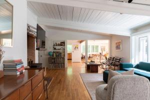 a living room with a couch and a table at Gunn Brook Mountain House in Cornwall