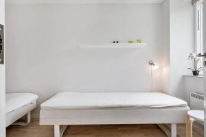 Ένα ή περισσότερα κρεβάτια σε δωμάτιο στο M13007-Vaeggerlose-Marielyst-Strandvej-63-Z