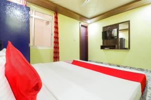 Ένα ή περισσότερα κρεβάτια σε δωμάτιο στο Hotel O A-Square Homes