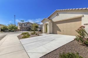 a house with a driveway and a garage at Golden Marigold Sanctuary in Buckeye