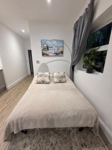 Ένα ή περισσότερα κρεβάτια σε δωμάτιο στο Cozy getaway