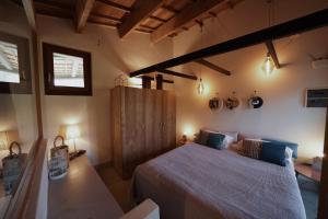 a bedroom with a large bed in a room at Borgo Lianti case vacanza Sardegna in San Pasquale +90 photos