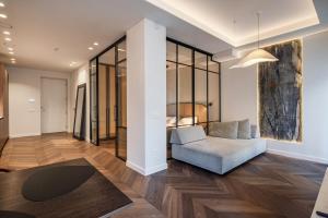 a living room with a couch and a table at Golden Dunes & SPA in Nida +25 photos