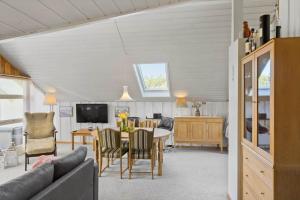 a living room with a couch and a table at M365-Gedser-Lollandsvej-9 in Gedser