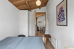 a bedroom with a bed and a dining room at M370-Vaeggerlose-Boto-Ringvej-22 in Bøtø By
