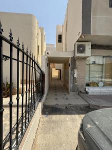 a hallway of a building with a fence at DownTown Suites OrbitNet RUH 4 in Riyadh