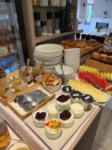 a buffet filled with different types of food on a table at Hotel Llafranch in Llafranc
