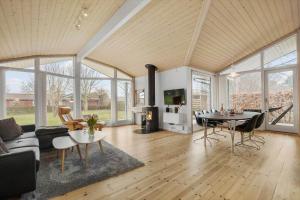 a living room with a couch and a table at SL302-Slagelse-Dunhammervej-4 in Slagelse
