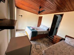Katil atau katil-katil dalam bilik di Bem Natural - Pousada e Camping