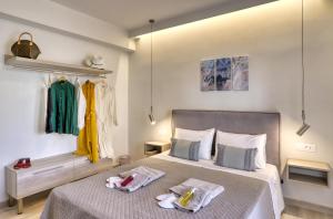 a bedroom with two beds with towels on them at Casa Do Ma Ni, Sitia in Sitia