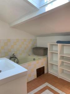 a bathroom with a sink and a bath tub at Maison Espelida in Le Pradet +26 photos