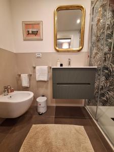a bathroom with a sink and a mirror at Casa Paola in Borso del Grappa