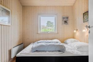 a bed in a room with a window at SL313-Slagelse-Rorhonevej-12 in Slagelse