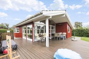 a pavilion on a deck with a table and chairs at SL313-Slagelse-Rorhonevej-12 in Slagelse +16 photos