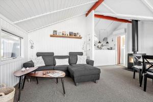 a living room with a couch and a table at SL310-Slagelse-Birkevej-49 in Slagelse +28 photos