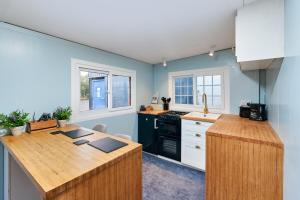 a kitchen with a wooden counter top in a room at Cozy log cabin in Edenderry