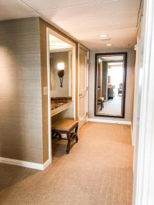 a hallway with a mirror and a bench in a hallway at The Westin Riverwalk, San Antonio in San Antonio