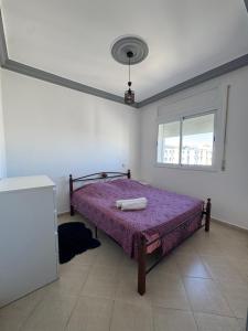 Una cama o camas en una habitación de Appartement spacieux Idéal famille proche de toutes commodité