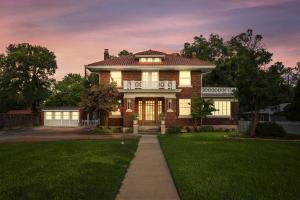 a large brick house with a lawn in front of it at Walk to Schlitterbahn & Downtown Sleeps 12 in New Braunfels