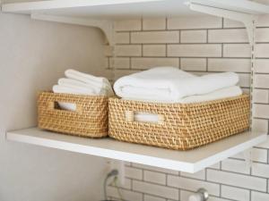 two baskets of towels sitting on a shelf in a bathroom at T,square - Vacation STAY 11449v in Awaji +61 photos