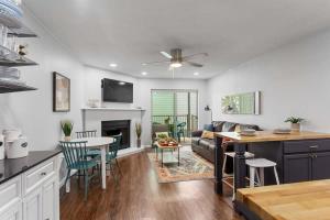 a kitchen and living room with a couch and a table at Shared Hot Tub & Pool Grill River Access in New Braunfels