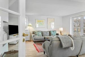 a living room with a couch and a tv at 20121-Samso-Landevejen-46-B in Nordby