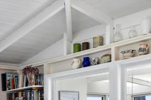 a shelf with vases and vases on it at 20508-Samso-Onsbjerg-Vestermark-63 in Sælvig +28 photos