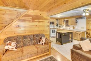 a living room with a couch and a kitchen at Horses Welcome! Jamestown Home with Fenced Pasture in Jamestown