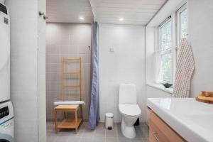 a bathroom with a shower and a toilet and a sink at 20399-Samso-Laerkevej-24 in Nordby +25 photos