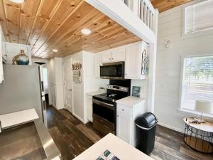 a kitchen with a stove and a refrigerator at Resort at Fredericksburg Unit 4 in Rocky Hill +28 photos