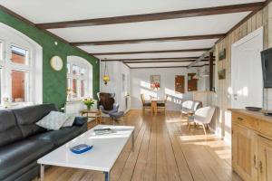 a living room with a couch and a table at AE306-Marstal-Skovgyden-28 in Marstal