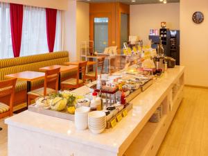 a buffet line with food on it in a restaurant at Smile Hotel Kushiro - Vacation STAY 10575v in Kushiro