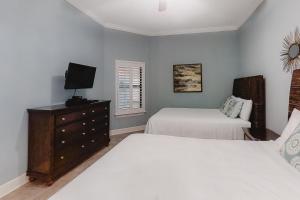 Ένα ή περισσότερα κρεβάτια σε δωμάτιο στο The Oasis 1709 +70 φωτογραφίες