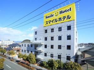 a large white building with a sign on it at Smile Hotel Kakegawa - Vacation STAY 77614v in Kakegawa