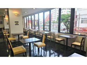 a restaurant with tables and chairs and a large window at Smile Hotel Okinawa Naha - Vacation STAY 04084v in Naha