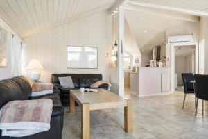 a living room with a couch and a table at SB110-Nordborg-Sostjerneparken-36 in Nordborg