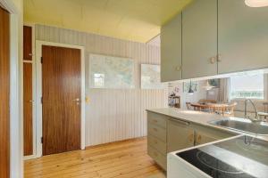 a kitchen with a sink and a counter top at SB50626-Sydals-Egemose-157 in Skovmose +9 photos