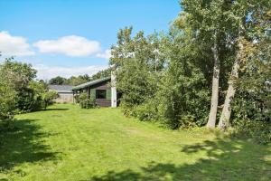 a yard with a house in the background at SB50626-Sydals-Egemose-157 in Skovmose