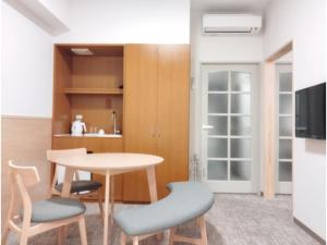 a kitchen with a table and two chairs at DIG the Osaka - Vacation STAY 96973v in Suita