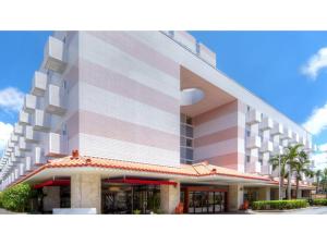 a rendering of a large building with palm trees at Smile Hotel Naha City Resort - Vacation STAY 05994v in Naha