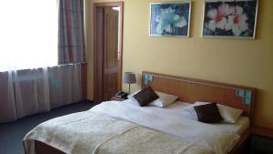 Postel nebo postele na pokoji v ubytování Hotel Cascade