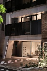 an external view of a building with a balcony at Cava House - Vacation STAY 07286v in Tokyo