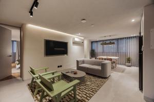 a living room with a couch and a table at Sereno Building in Medellín