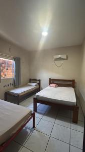 En eller flere senge i et værelse på Paraíso Oculto